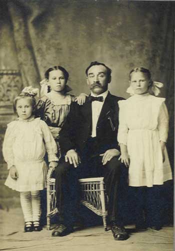 Unidentified moustache man and children.jpg